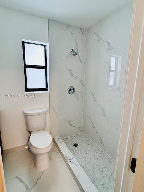 11730 NW 3rd Ave, Miami, FL 33168 - bathroom featuring a marble finish shower, marble finish floor, and toilet