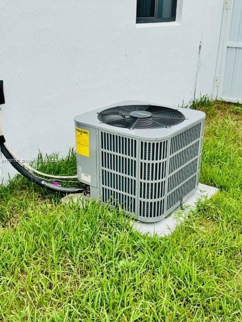 11730 NW 3rd Ave, Miami, FL 33168 - exterior details with central AC unit and stucco siding