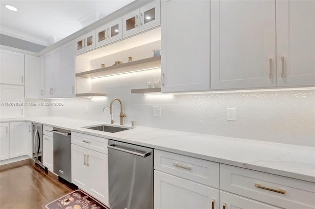 kitchen featuring ornamental molding, a sink, backsplash, white cabinetry, and dishwasher