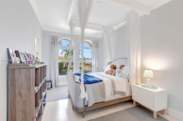 bedroom with baseboards and ornamental molding