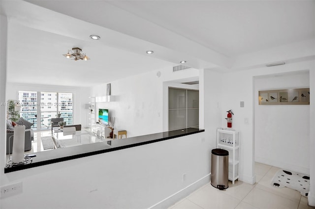 19370 Collins Ave Unit 1504, Sunny Isles Beach, FL 33160 - kitchen with dark countertops, recessed lighting, white cabinets, a sink, and stainless steel appliances