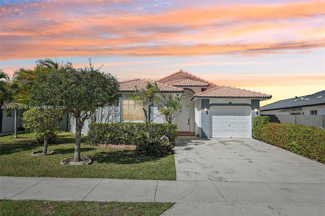 18234 SW 143rd Pl, Miami, FL 33177 - mediterranean / spanish-style house with a yard, stucco siding, concrete driveway, a garage, and a tile roof