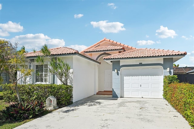 18234 SW 143rd Pl, Miami, FL 33177 - mediterranean / spanish house with stucco siding, driveway, an attached garage, and a tiled roof