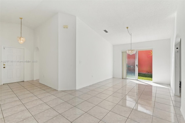 18234 SW 143rd Pl, Miami, FL 33177 - empty room with light tile patterned floors, visible vents, and a chandelier