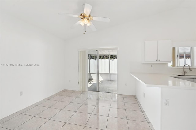 18234 SW 143rd Pl, Miami, FL 33177 - spare room featuring a sink, light tile patterned flooring, a ceiling fan, and vaulted ceiling