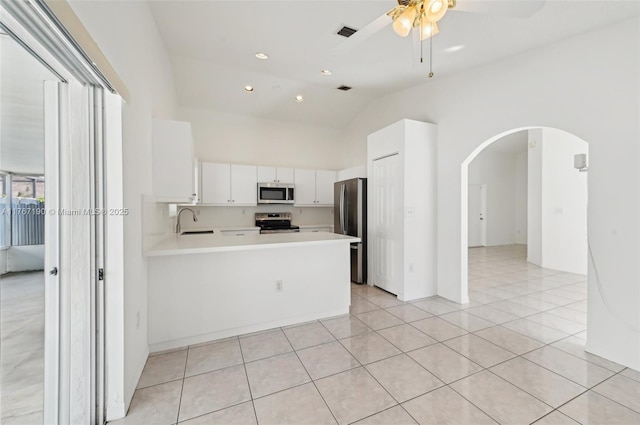 18234 SW 143rd Pl, Miami, FL 33177 - kitchen with visible vents, a sink, arched walkways, appliances with stainless steel finishes, and light countertops