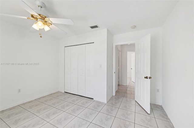 18234 SW 143rd Pl, Miami, FL 33177 - unfurnished bedroom featuring light tile patterned floors, a ceiling fan, visible vents, baseboards, and a closet