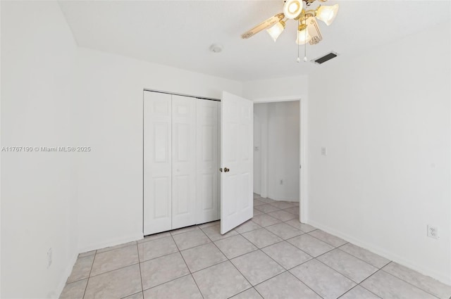 18234 SW 143rd Pl, Miami, FL 33177 - unfurnished bedroom featuring visible vents, baseboards, light tile patterned floors, a closet, and a ceiling fan
