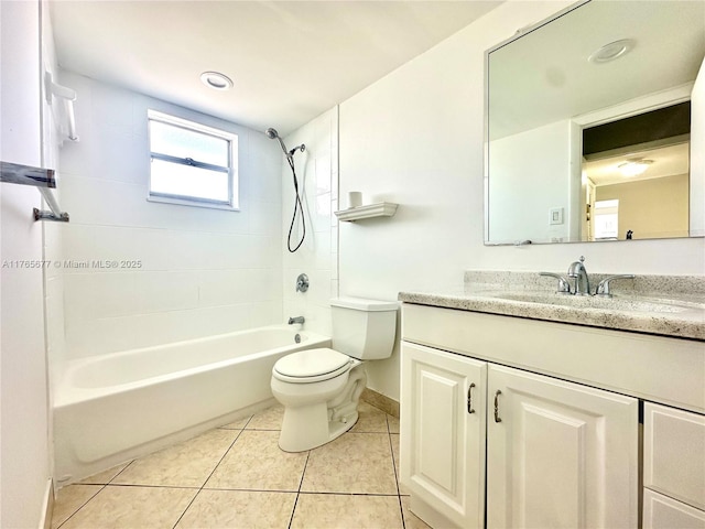 full bath featuring toilet, vanity, baseboards, tile patterned flooring, and bathing tub / shower combination