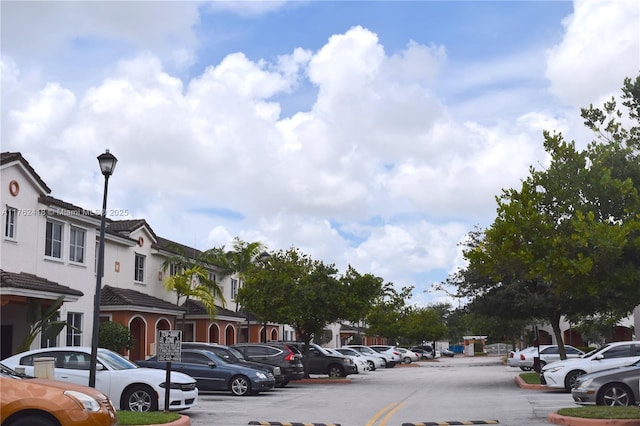17347 NW 7th Ave Unit 907, Miami Gardens, FL 33169 - uncovered parking lot featuring a residential view