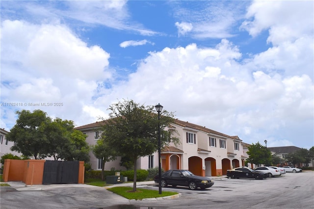 17347 NW 7th Ave Unit 907, Miami Gardens, FL 33169 - mediterranean / spanish-style home featuring uncovered parking and stucco siding