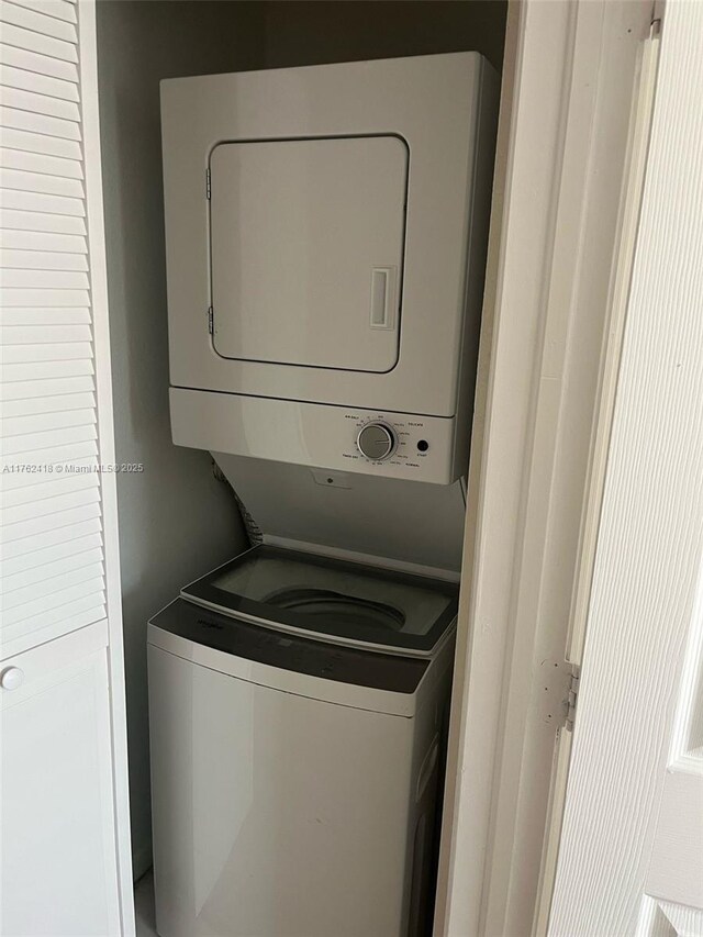 17347 NW 7th Ave Unit 907, Miami Gardens, FL 33169 - washroom with laundry area and stacked washer / drying machine