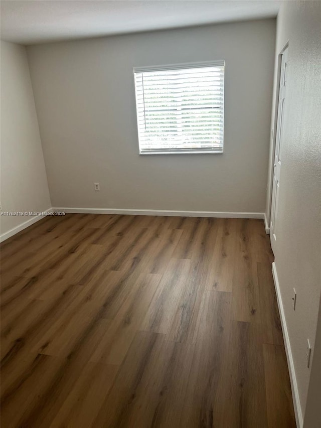 17347 NW 7th Ave Unit 907, Miami Gardens, FL 33169 - empty room with baseboards and wood finished floors