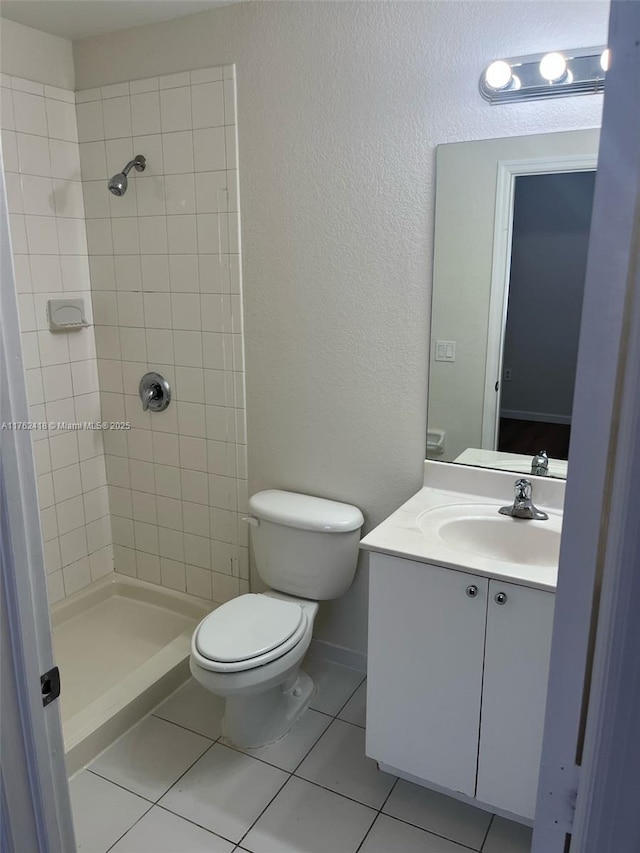 17347 NW 7th Ave Unit 907, Miami Gardens, FL 33169 - full bathroom featuring toilet, tile patterned floors, tiled shower, and vanity