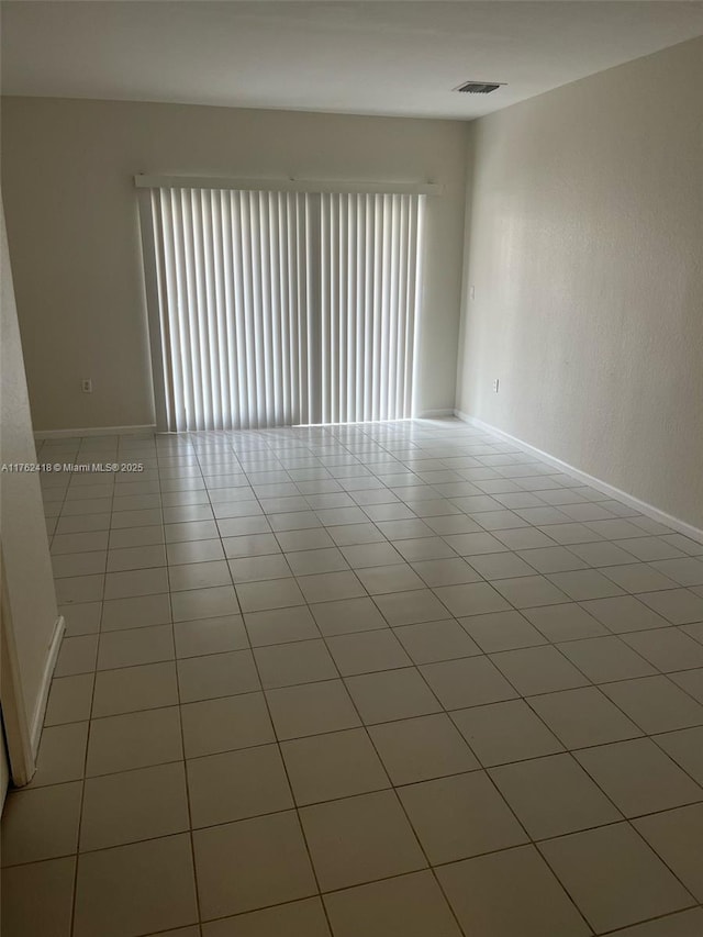 17347 NW 7th Ave Unit 907, Miami Gardens, FL 33169 - unfurnished room featuring visible vents, baseboards, and light tile patterned flooring