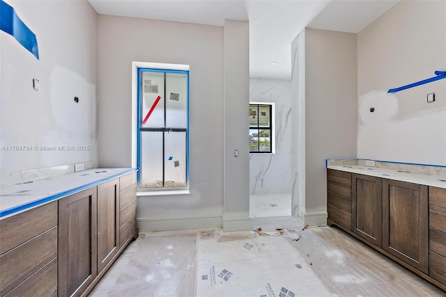 325 N Fairway N, Tequesta, FL 33469 - bathroom featuring a marble finish shower and vanity