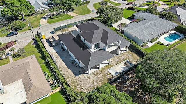 aerial view of residential area featuring a pool area