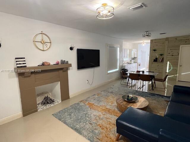 living area featuring visible vents