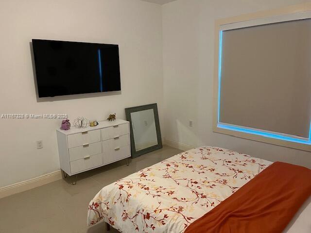 bedroom with baseboards