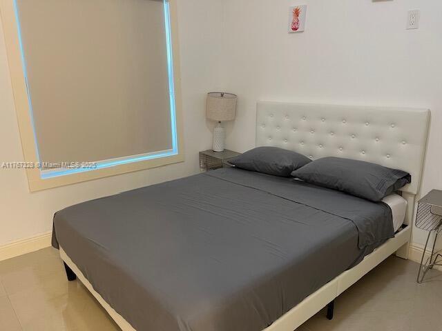 bedroom with baseboards