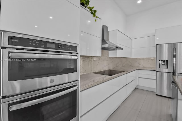 710 Lake Blvd, Weston, FL 33326 - kitchen featuring modern cabinets, stainless steel appliances, wall chimney exhaust hood, and white cabinetry