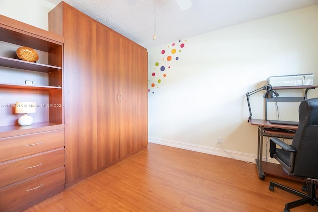5000 NW 36th St Unit 509, Lauderdale Lakes, FL 33319 - office featuring baseboards, a textured ceiling, vaulted ceiling, and light wood finished floors