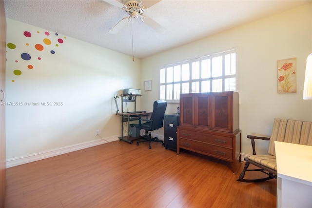 5000 NW 36th St Unit 509, Lauderdale Lakes, FL 33319 - office area with light wood-type flooring, baseboards, a textured ceiling, and ceiling fan
