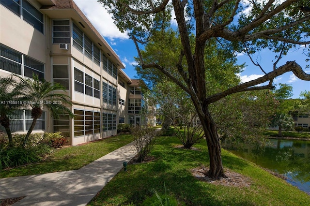 5000 NW 36th St Unit 509, Lauderdale Lakes, FL 33319 - surrounding community featuring a lawn