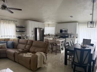 living area featuring a ceiling fan
