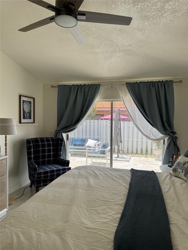 bedroom featuring a textured ceiling, multiple windows, access to exterior, ceiling fan, and vaulted ceiling