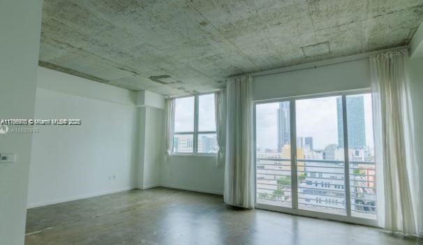 133 NE 2nd Ave Unit 1409, Miami, FL 33132 - empty room featuring concrete flooring