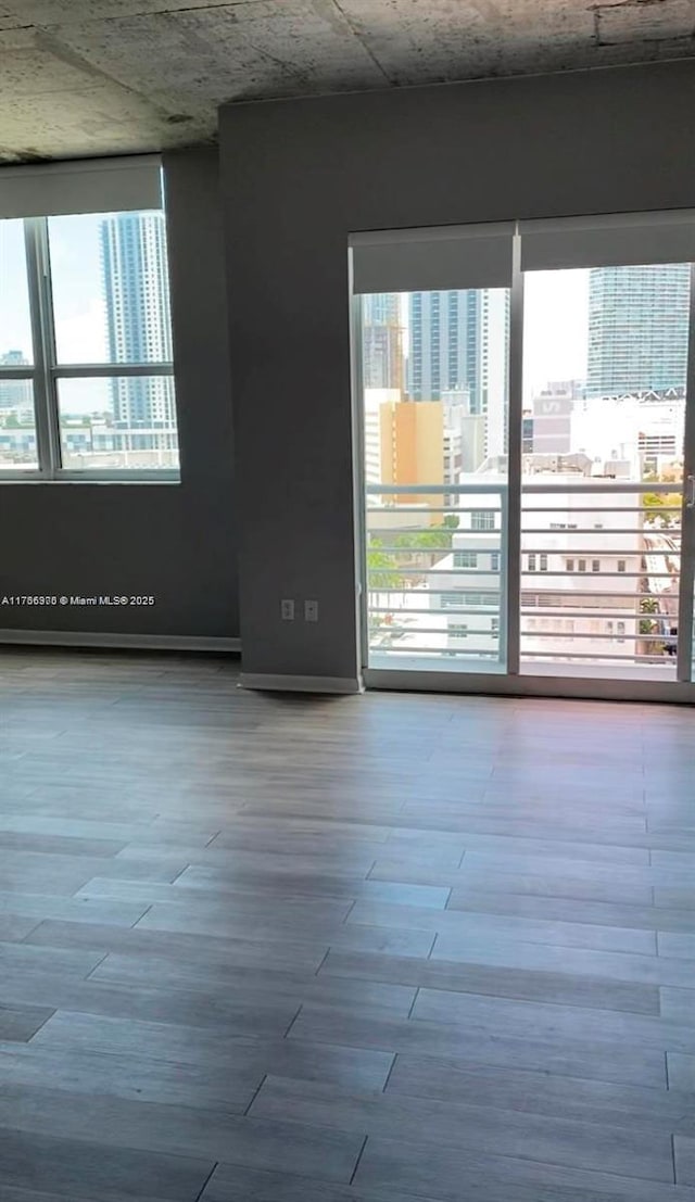 133 NE 2nd Ave Unit 1409, Miami, FL 33132 - unfurnished room featuring wood finished floors
