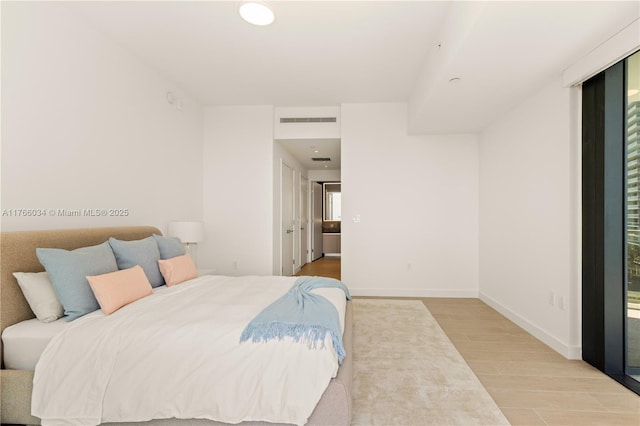 500 Alton Rd Unit 1201, Miami Beach, FL 33139 - bedroom with wood finished floors, visible vents, and baseboards