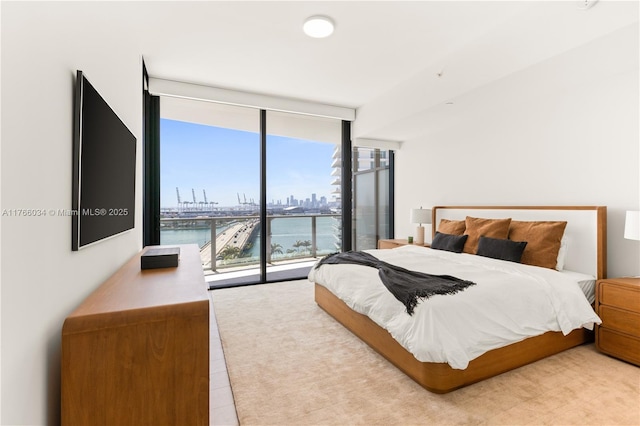 500 Alton Rd Unit 1201, Miami Beach, FL 33139 - bedroom featuring floor to ceiling windows and access to exterior