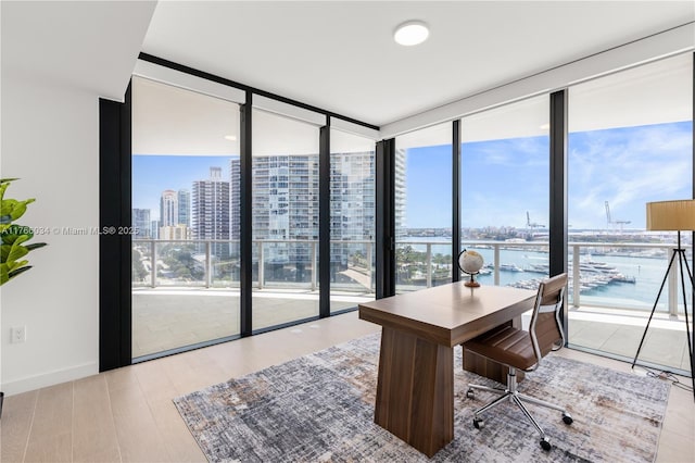 500 Alton Rd Unit 1201, Miami Beach, FL 33139 - office featuring expansive windows, a water view, baseboards, a city view, and wood finished floors