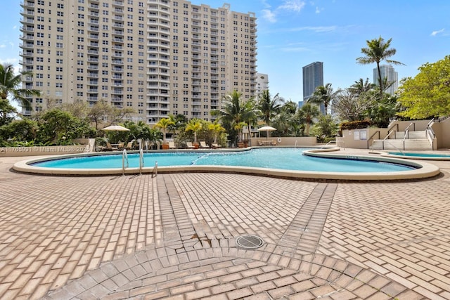 community pool featuring a patio area
