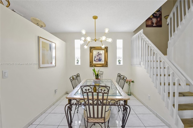 tiled dining area featuring baseboards, stairs, a textured ceiling, and a notable chandelier
