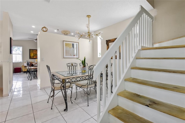 dining space with tile patterned floors, a chandelier, stairs, recessed lighting, and baseboards