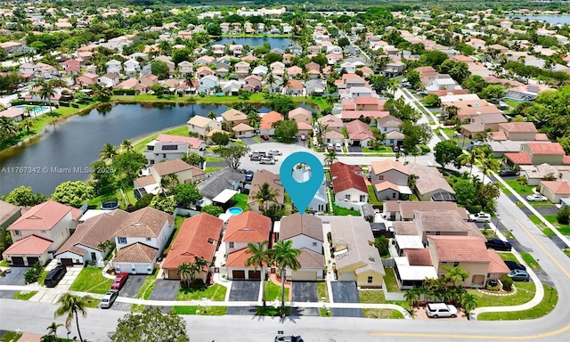 bird's eye view featuring a water view and a residential view