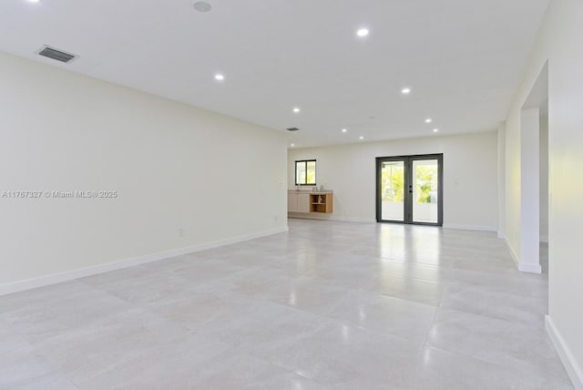 unfurnished room with recessed lighting, visible vents, french doors, and baseboards