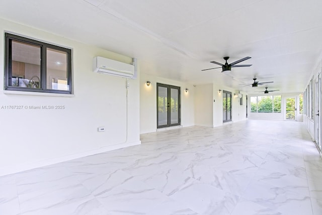 view of patio / terrace featuring ceiling fan, french doors, and a wall unit AC