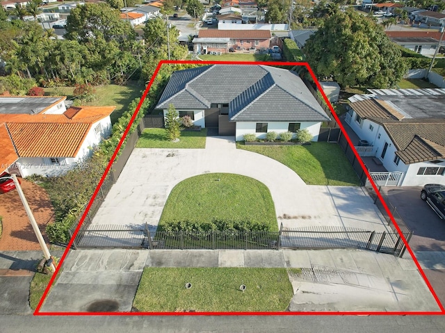 birds eye view of property with a residential view