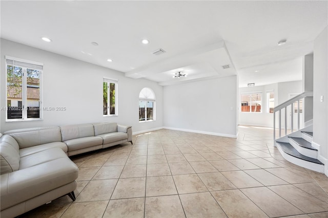 living room with light tile patterned flooring, plenty of natural light, recessed lighting, and visible vents