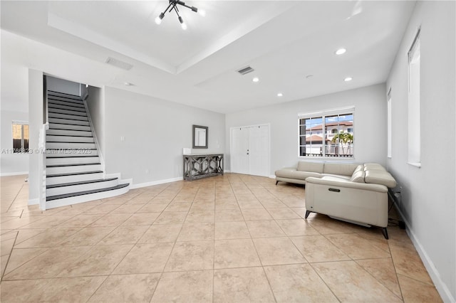 unfurnished living room with visible vents, baseboards, stairway, light tile patterned floors, and recessed lighting