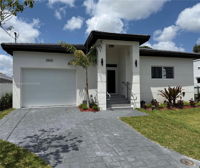 3431 NW 14th Ter, Miami, FL 33125 - ranch-style home featuring an attached garage, stucco siding, decorative driveway, and a front lawn