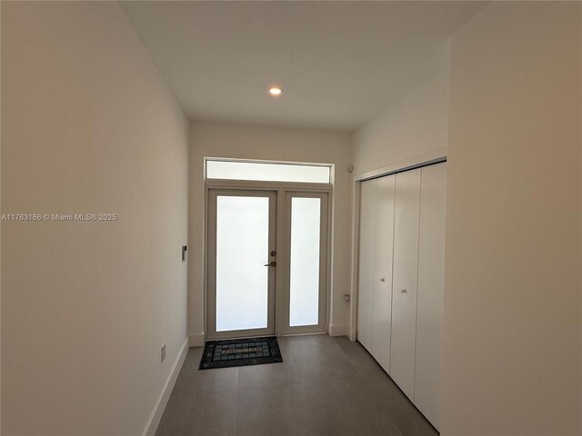 3431 NW 14th Ter, Miami, FL 33125 - doorway to outside with baseboards and recessed lighting