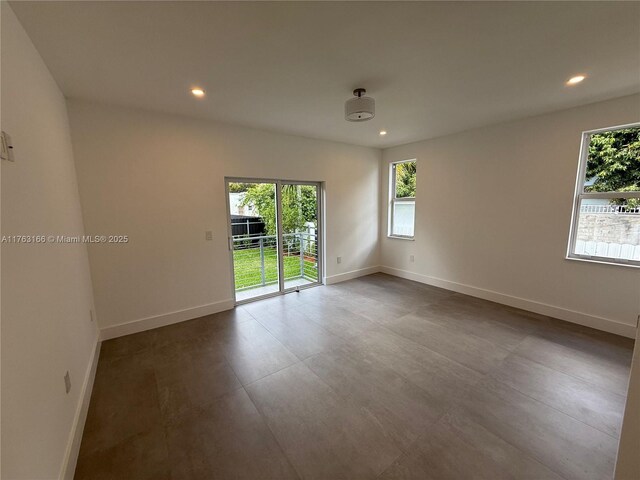 3431 NW 14th Ter, Miami, FL 33125 - kitchen with a kitchen island, open floor plan, light countertops, and recessed lighting