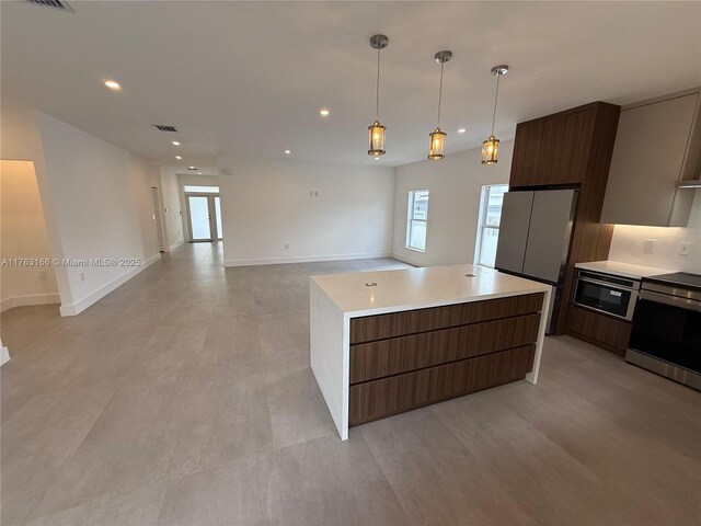 3431 NW 14th Ter, Miami, FL 33125 - kitchen featuring recessed lighting, light countertops, stainless steel electric range oven, a kitchen island, and modern cabinets