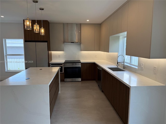 3431 NW 14th Ter, Miami, FL 33125 - kitchen with light countertops, a sink, stainless steel appliances, modern cabinets, and wall chimney range hood
