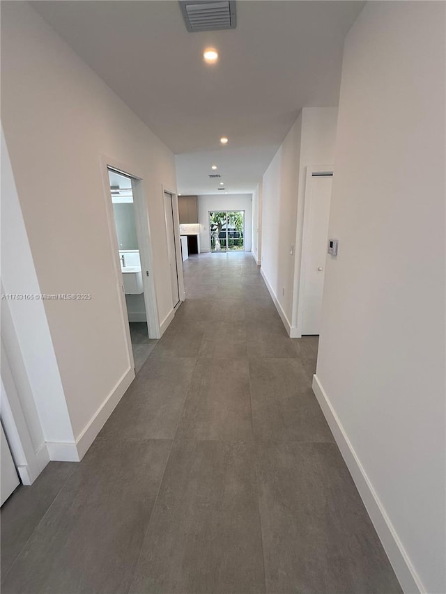 3431 NW 14th Ter, Miami, FL 33125 - corridor featuring baseboards, recessed lighting, and visible vents